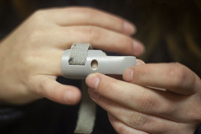 Cropped hands of person with medical equipment