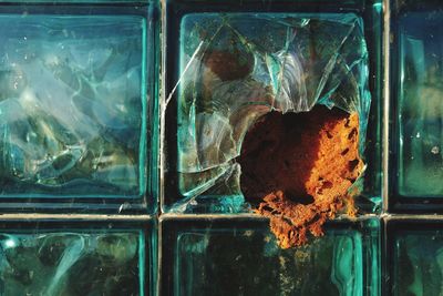 Close-up of broken glass window