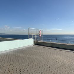 Scenic view of sea against blue sky