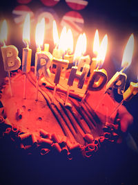 Burning candles on birthday cake