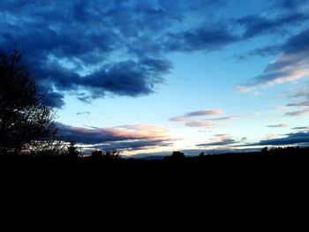 Scenic view of silhouette landscape against sky at sunset