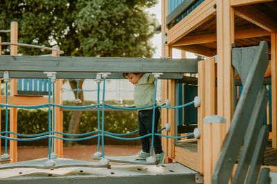 Side view of child playing at park