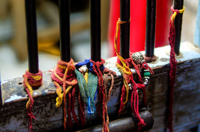 Religious threads tied on fence in temple