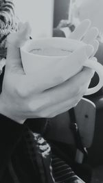 Close-up of woman holding coffee cup