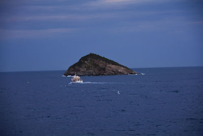 Scenic view of sea against blue sky