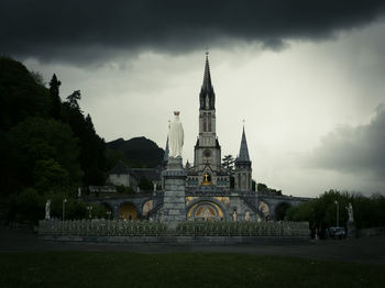 Building against cloudy sky