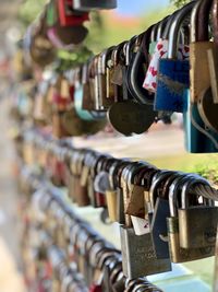 Close-up of padlocks hanging on railing