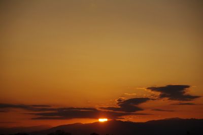 Scenic view of mountains at sunset