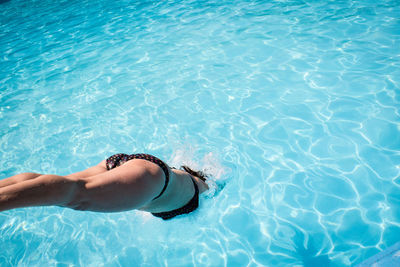 High angle view of woman swimming in pool