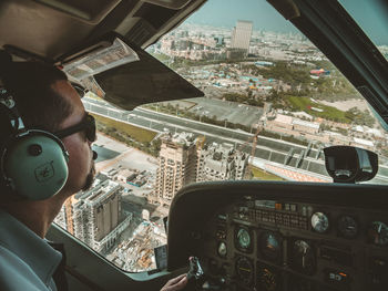 Aerial view of cityscape seen through airplane window
