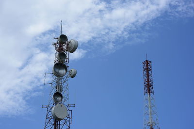 Low angle view of communications tower against sky