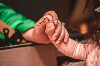 Midsection of woman holding hands