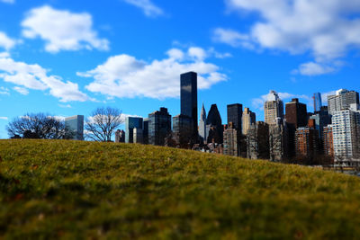 Buildings in city against sky