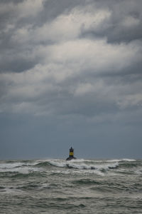 Boat sailing in sea against sky