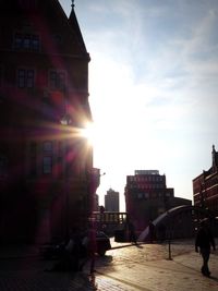 Buildings against sky on sunny day