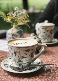 Close-up of coffee cup on table