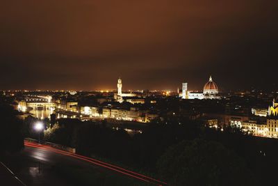 High angle view of city lit up at night