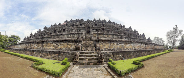 View of temple against cloudy sky