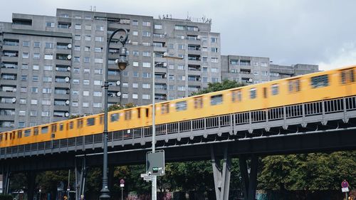 Train against modern buildings in city