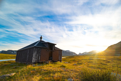 Small wooden hut in the middle of the sarek national park, sweden. 