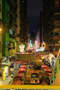 Vehicles on road in city at night