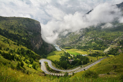 High angle view of mountain road against cloudy sky