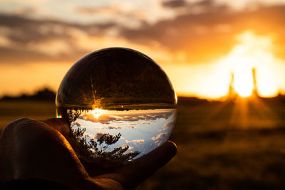 Sunset seen through refraction glass ball