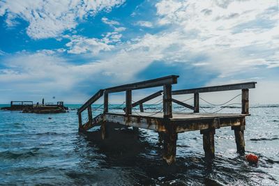 Pier over sea against sky