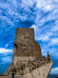 Low angle view of historical building against cloudy sky