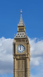 Low angle view of building against clear blue sky