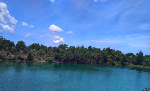 Scenic view of lake against blue sky