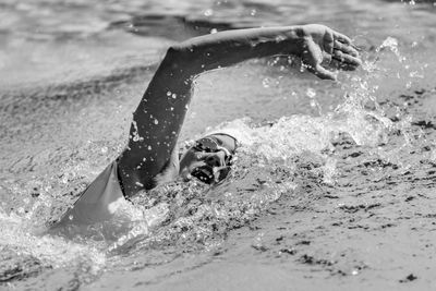 High angle view of woman swimming in sea