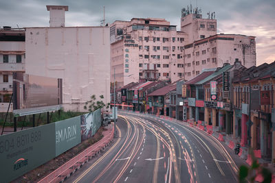 Road in city against sky