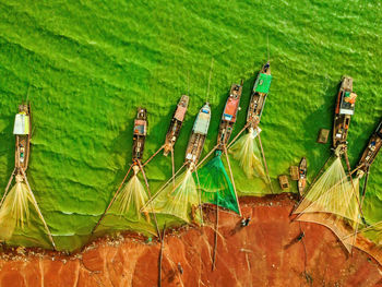 Aerial view of fishing boat moored at harbor