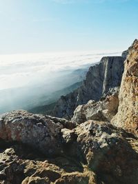 Scenic view of sea and mountains against sky