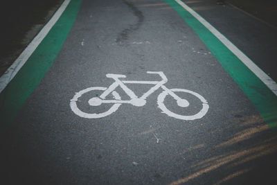 High angle view of bicycle sign on road