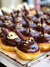 Close-up of chocolate doughnuts on table in store
