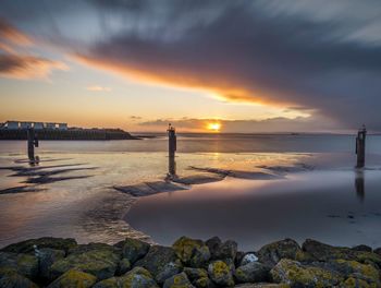 Scenic view of sea against sky during sunset