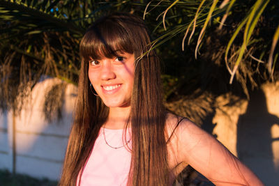 Teenager latin american girl with long hair smiling
