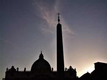 Low angle view of silhouette building against sky during sunset