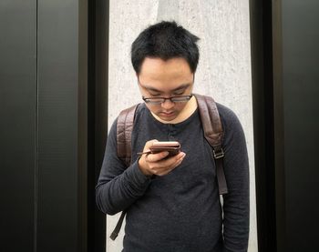 Young man using mobile phone