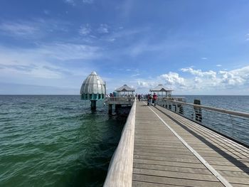 Pier over sea against sky