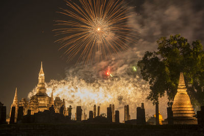 Firework display at night