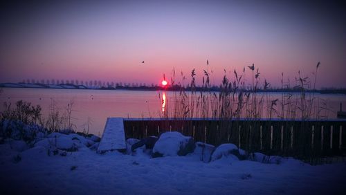 Scenic view of sea at sunset