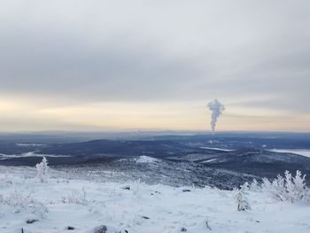 Scenic view of snow covered mountain against sky