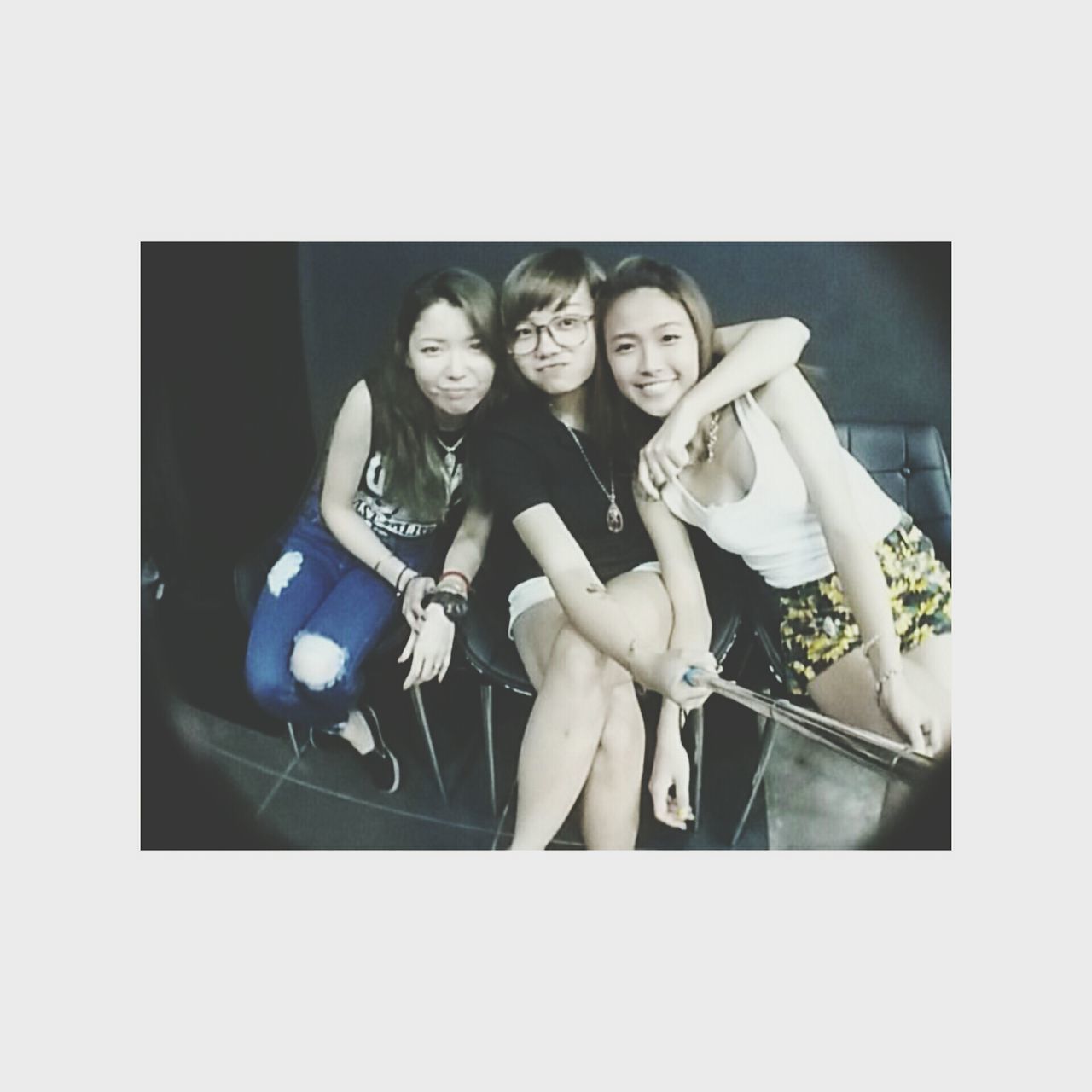 indoors, lifestyles, transfer print, young adult, leisure activity, young women, auto post production filter, front view, casual clothing, person, fashion, holding, studio shot, standing, togetherness, sitting, technology