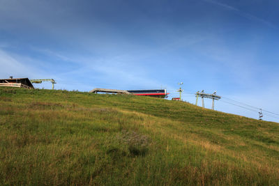 Built structure on field against sky