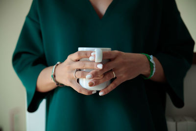 Close-up of man holding mobile phone
