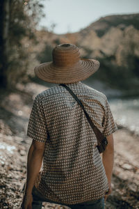 Rear view of man standing on beach