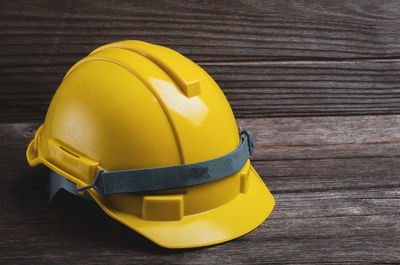 Close-up of yellow hat on table